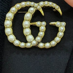 oGUCCIo Brooches